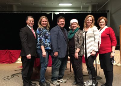 Christmas charity event at WJ Middle with Steve and Lisa James, Barbara Smith, Mayor Ramsey, Principal Kathy Ridding