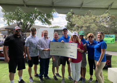 JEF Board at Golf Tourney getting a check from Walmart